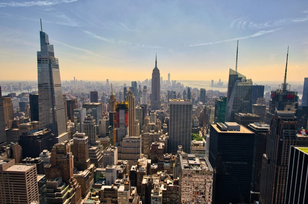 A breathtaking view of New York City's skyline with the Empire State Building in the center, showcasing urban architecture.